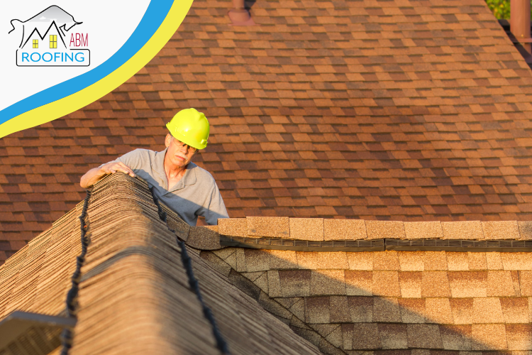An ABM Roofing roofer inspecting a roof in Greensboro, GA.