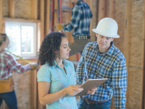 A roofer in Buckhead consulting with homeowners over roof design options.