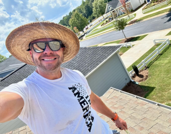 Professional inspecting a roof for damage in Eatonton before fall.